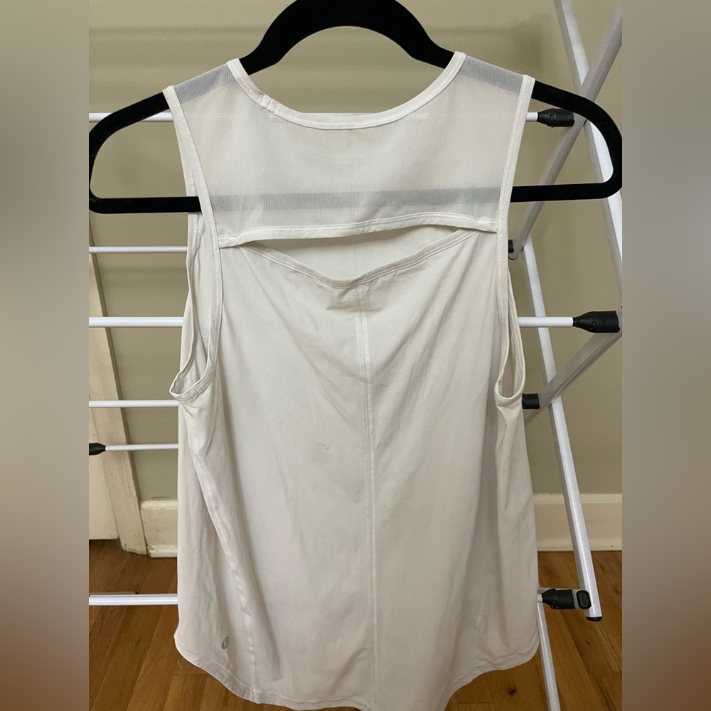 LuluLemon tank top with slit in back. White. Size 6